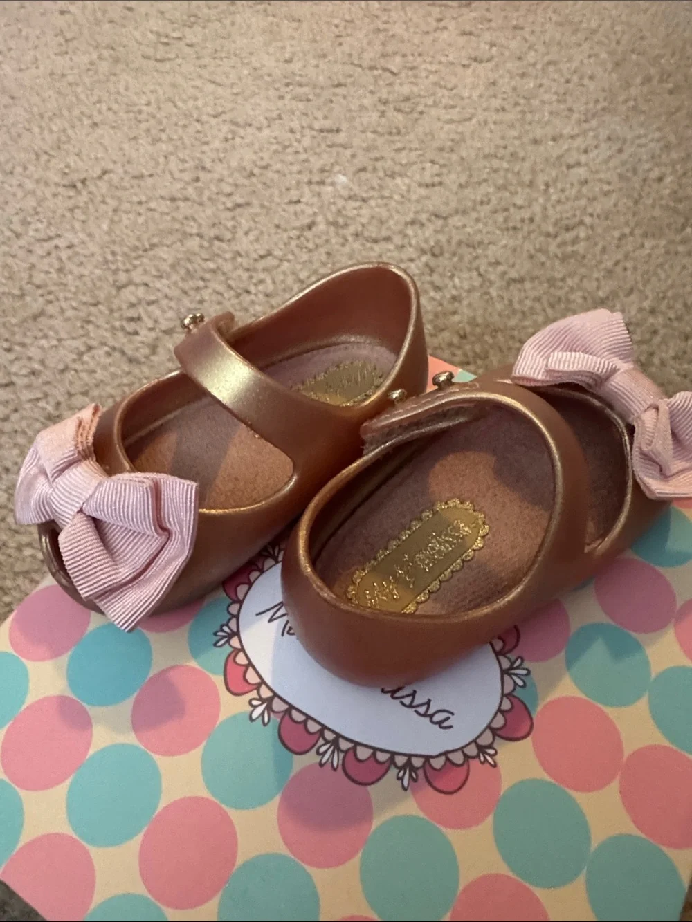 Mini Melissa Metallic Rose Gold Mary Janes with Pink Fabric Bows. Used w/box
